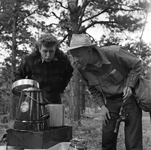 Posterazzi Couple Cooking Outdoors - Man Holding Fishing Rod Poster Print (18 x 24)