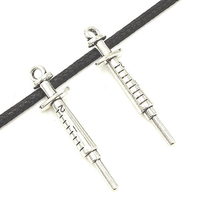 YOOGCORETT 15pcs Alloy Charms Syringe Pendants Beads Nurse Medical Theme Charms Bulk Silver Jewelry Making for Necklace Bracelet DIY Craft Findings Supplies Making 36 X 9mm (Ancient Silver)