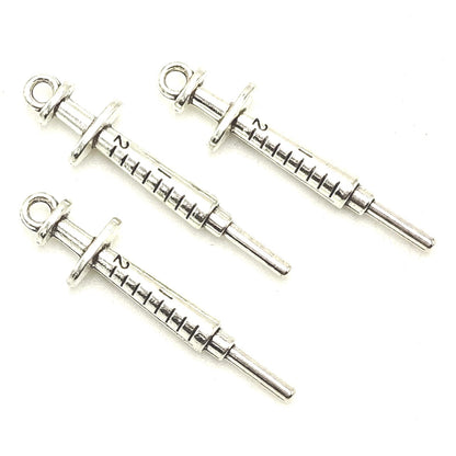 YOOGCORETT 15pcs Alloy Charms Syringe Pendants Beads Nurse Medical Theme Charms Bulk Silver Jewelry Making for Necklace Bracelet DIY Craft Findings Supplies Making 36 X 9mm (Ancient Silver)