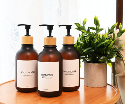Frosted Plastic Shampoo and Conditioner Bottles, Apothecary Dispenser Bamboo Pump, Refillable Bottles for Shower Lotion, Oil, Hand Soap, Sanitizer, Liquid Soap, Set of 3 with 9 Labels (3, Matte Amber)
