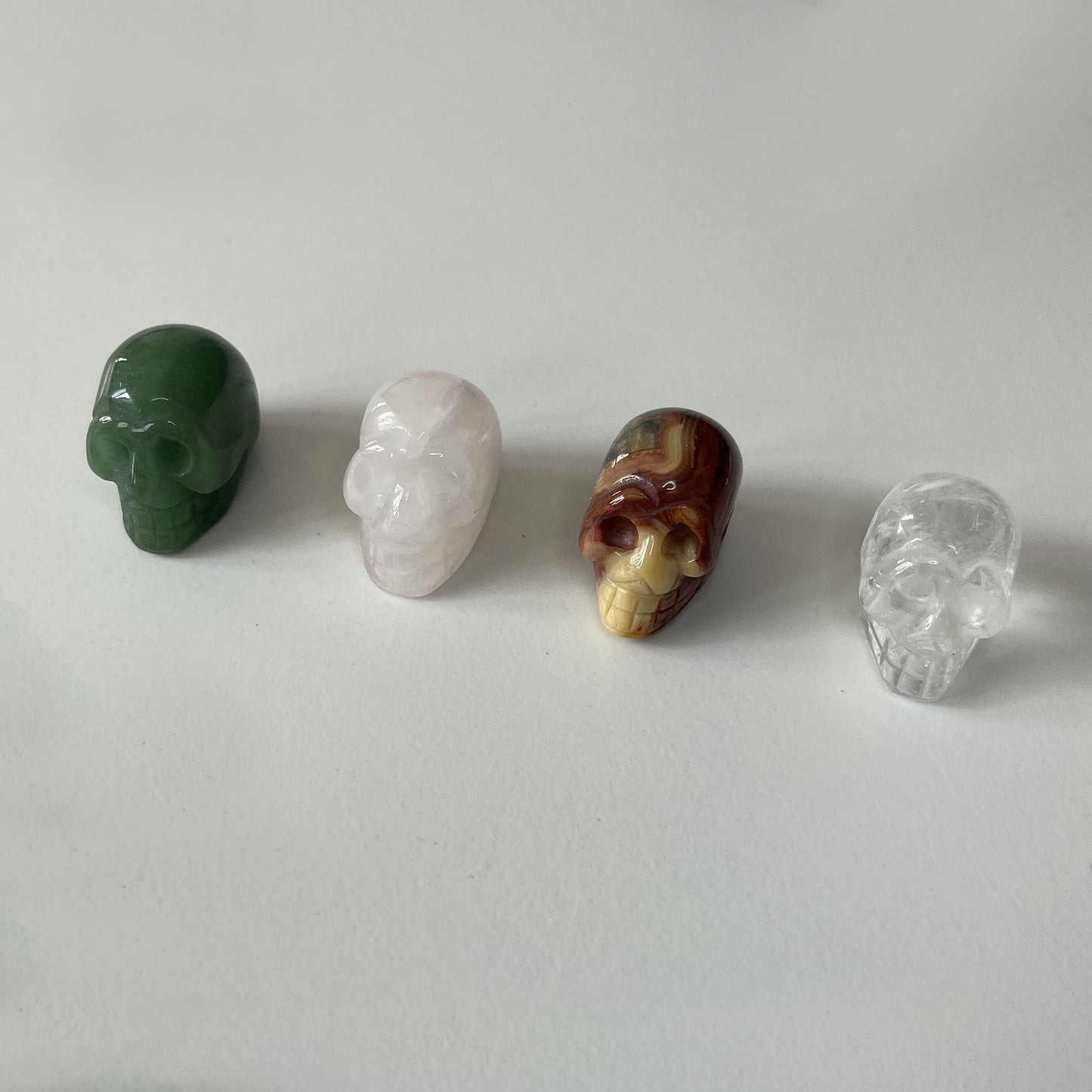 Byaning 4Pcs 1" Crystal Skull,Hand Carved Gemstone Skull, Natural Tiger Iron Eye & Rose Quartz & Green Aventurine & Black Obsidian Assorted, Healing Stone Statue