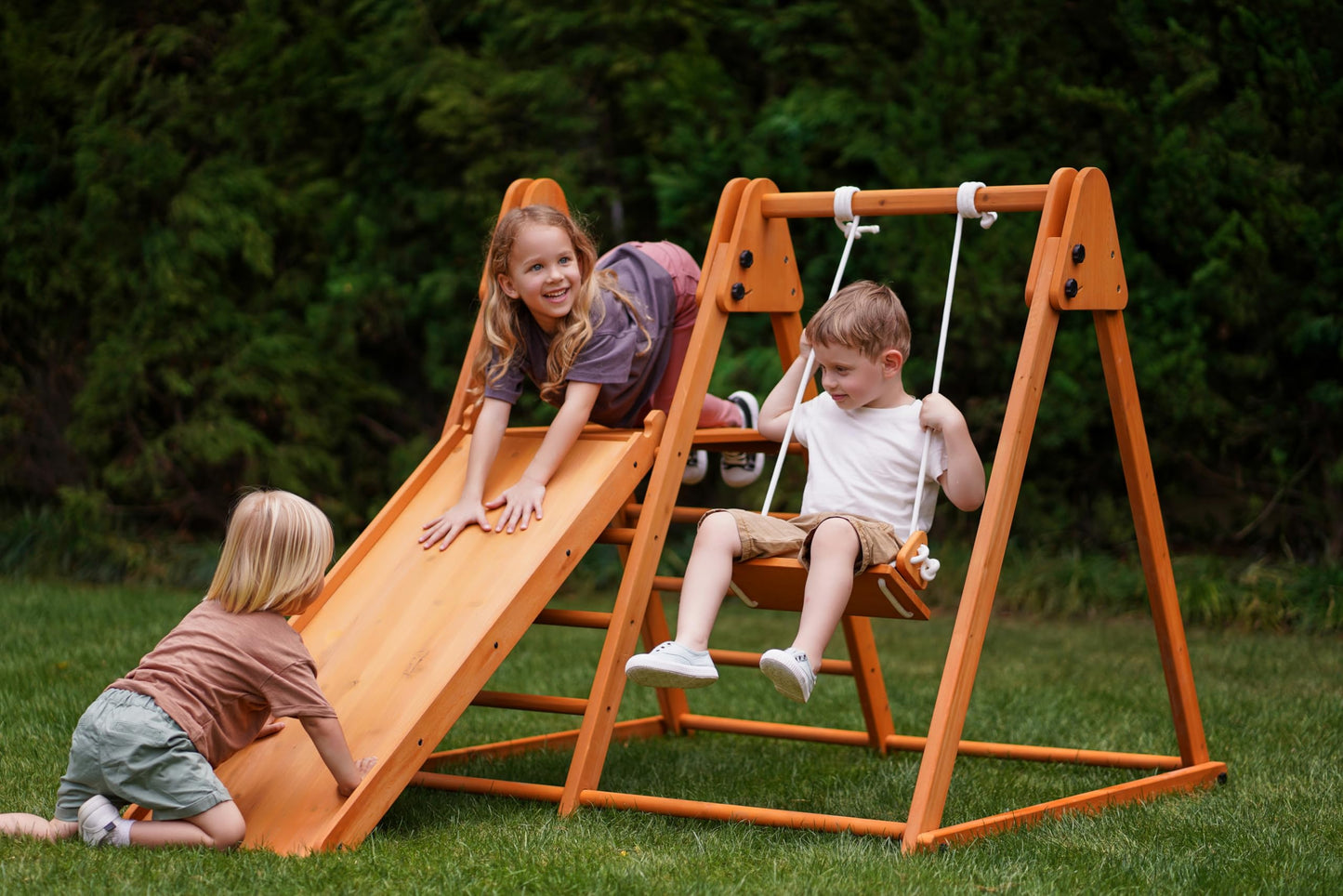 Avenlur 4-in-1 Juniper Outdoor Play Gym - Jungle Gym Playset with Baby Swing, Slide, Ladder, and Climbing Wall - Foldable Wooden Playset - Outdoor Jungle Gym for Kids Ages 18mo to 6yrs