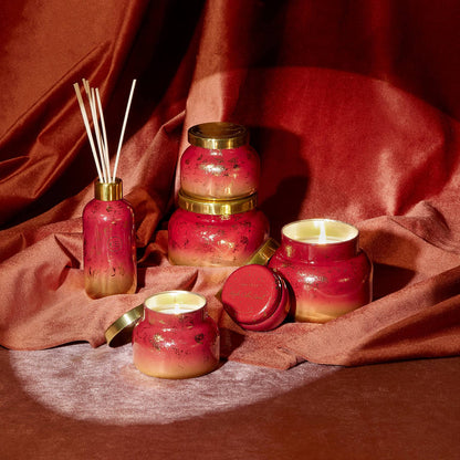 Capri Blue Scented Candles - Glimmer Collection - Ombre Glass Candle Holder - Luxury Apple Candles for Women & Men - Signature Jar in Cranberry Red and Gold (Apple Cider Social, 19 oz)