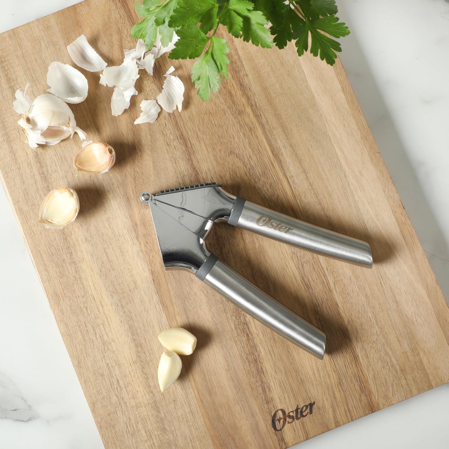 Oster Chadswyck 7.7” Garlic Press, Stainless Steel Garlic Mincer & Crusher, Easy Squeeze, Dishwasher Safe
