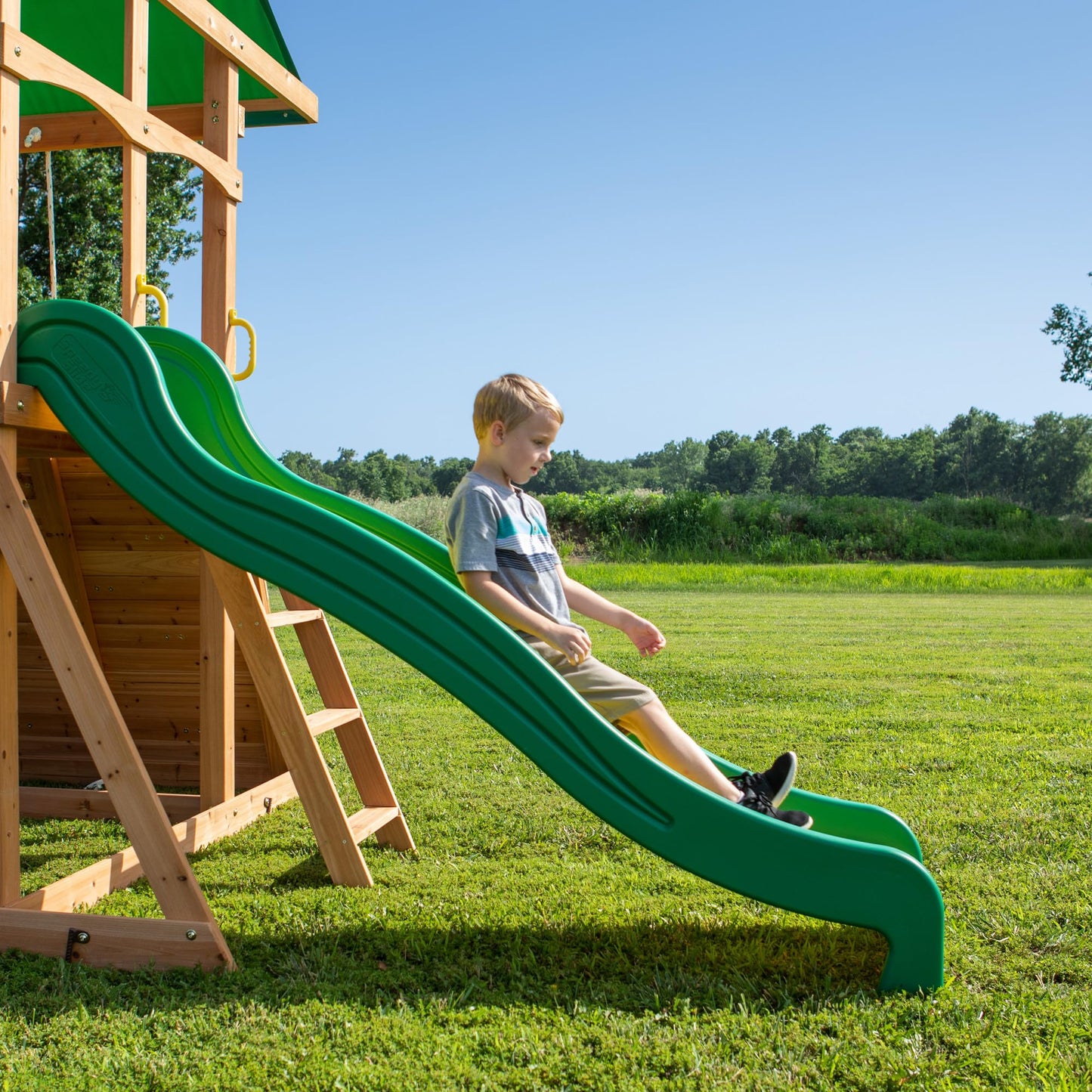Backyard Discovery Mount Mckinley Cedar Wood Swing Set with Wave Slide, Play Deck, Double Rock Wall, Rope Ladder, Web Swing, Belt Swings, Toy Telescope, Steering Wheel, Sandbox Area, Outdoor Playset